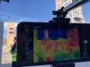 Thermal Imaging Camera shows a live feed of personnel inside a smokey building