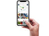 Image of a hand holding a smartphone showing a map