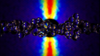 Colorful computer data patterns form a backdrop to a horizontal string of transparent spheres.