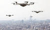 drones flying above cityscape