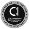 Round badge. Inner circle: fancy lowercase "A". Words: The 31st Annual Communicator Awards. Outer ring: Award of Distinction