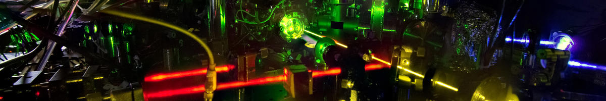 black background. brightly colored lasers shooting in multiple directions.